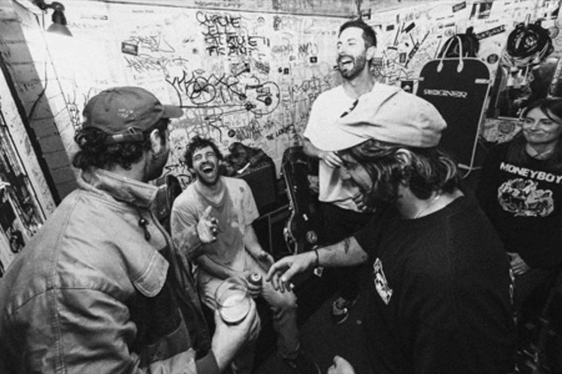 Band laughing together in a venue green room